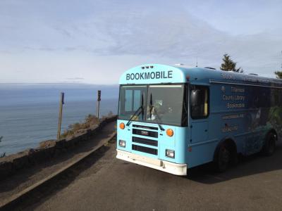 Bookmobile parked by ocean