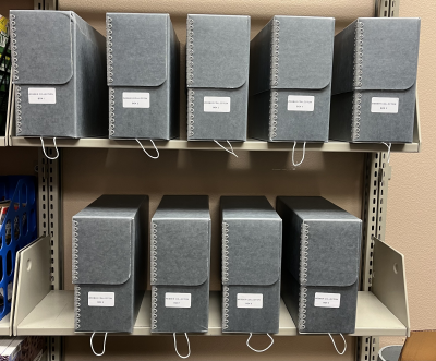 Image of the 9 Webber Collection boxes in the Tillamook Main Library Archives Room.